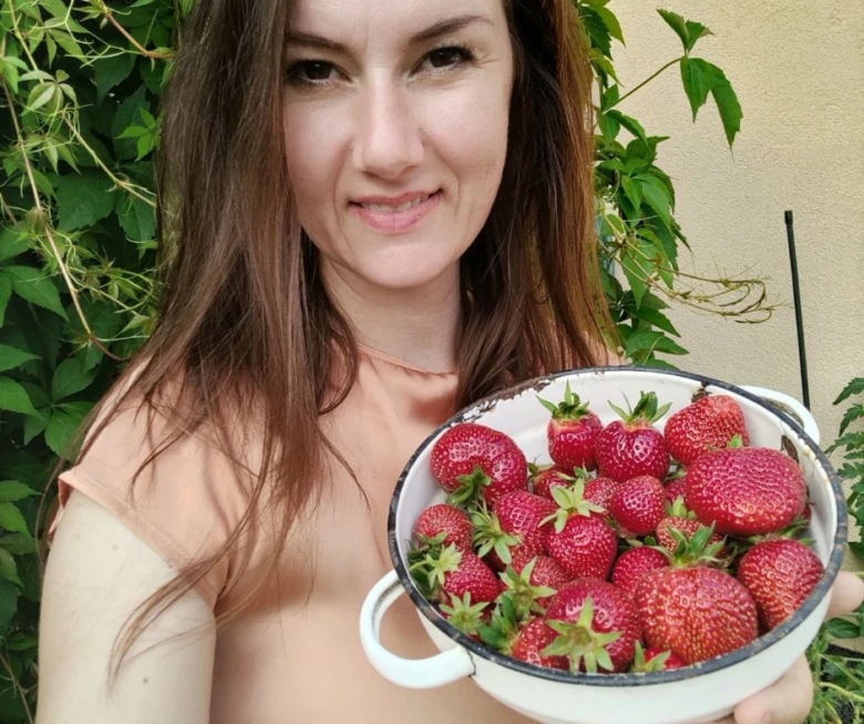 Woman holding strawberries